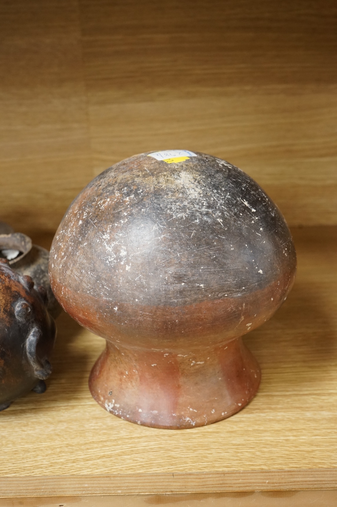 A collection of various South American vessels some in the form of grotesque heads, largest 24cm wide